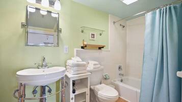Shower, hair dryer, towels, shampoo
