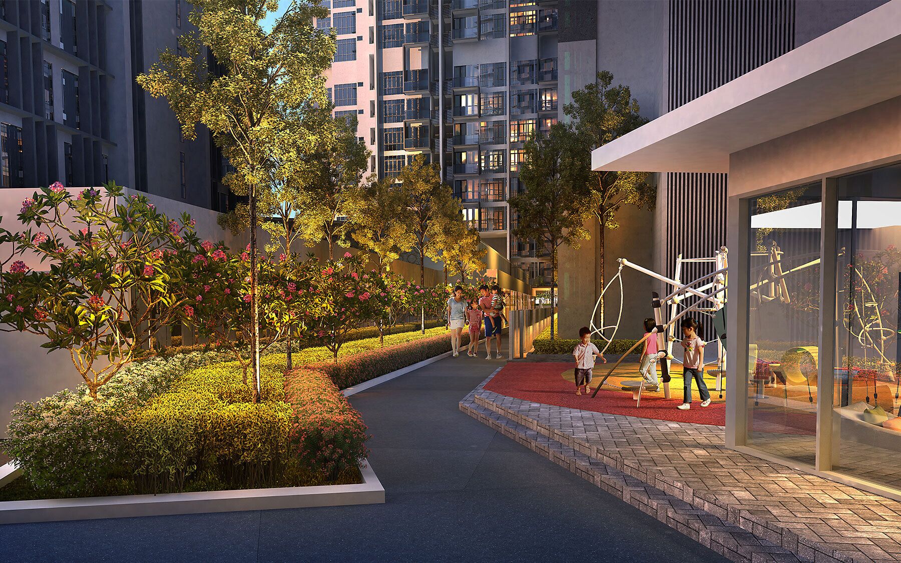 Una zona residencial moderna en la ciudad, con un sendero bordeado de árboles y arbustos que conduce a un edificio con balcones.