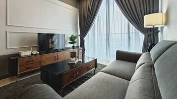 Senior Apartment | Living area | 40-inch Smart TV with digital channels, offices