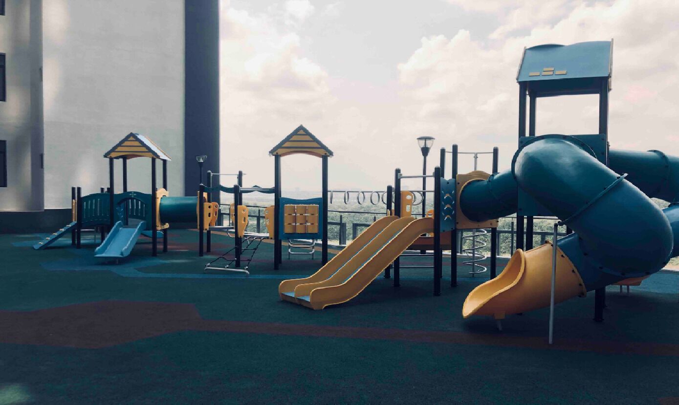 A playground with slides and climbing structures.