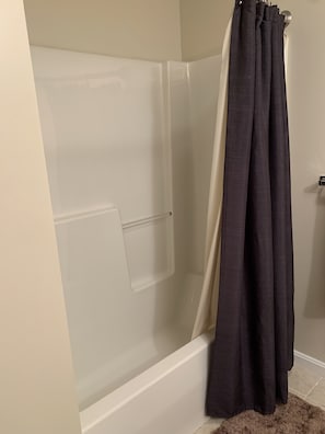 Shower, hair dryer, towels, toilet paper