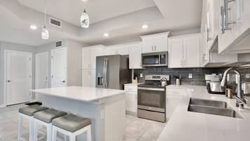 Coffee/tea maker, fridge, microwave, oven