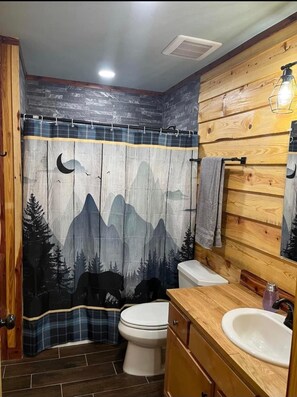 Shower, hair dryer, towels, toilet paper