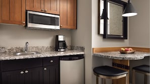 Fridge, microwave, coffee/tea maker, cookware/dishes/utensils