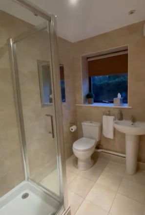 Shower, hair dryer, towels, soap