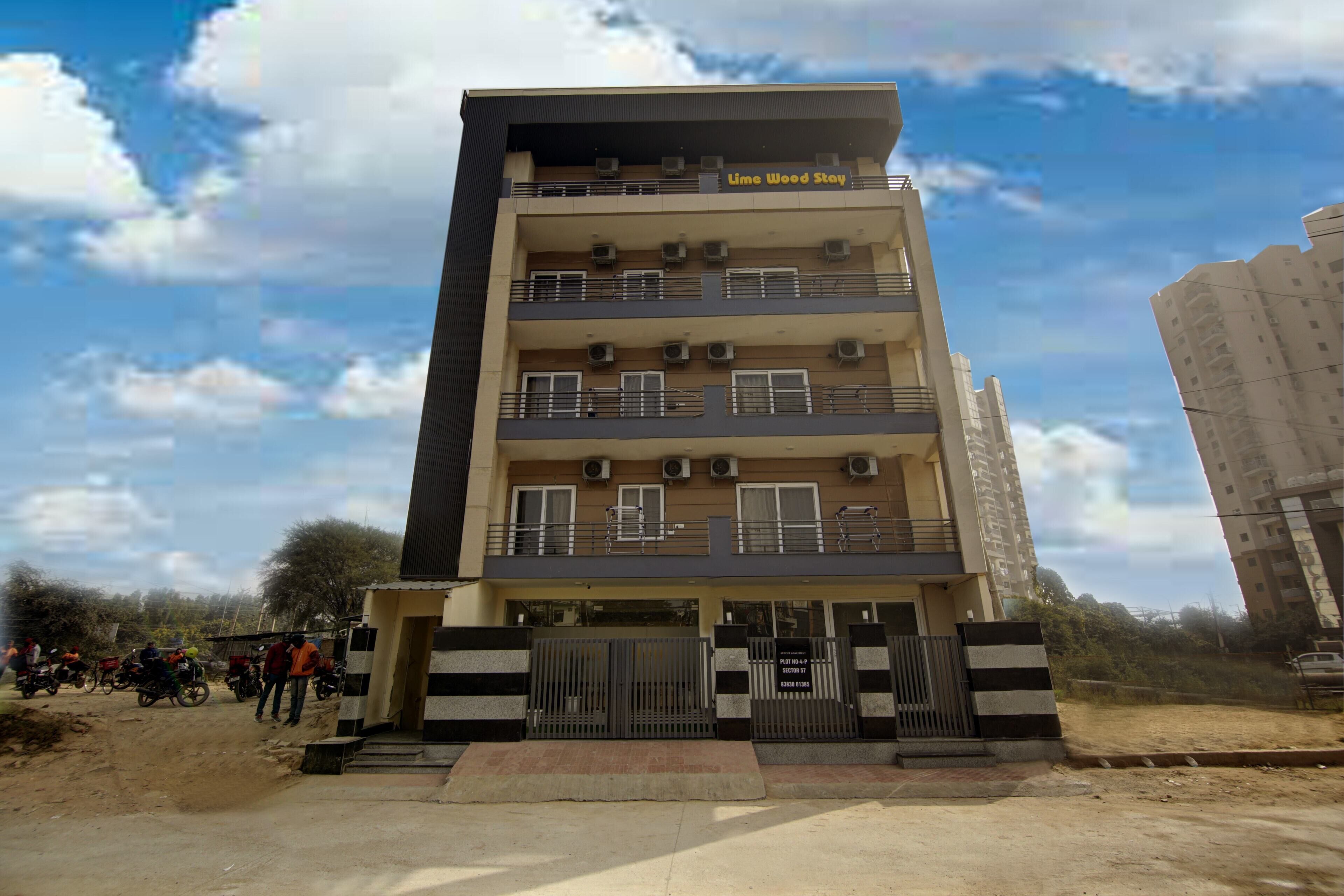 A multi-story building with balconies and air conditioning units, labeled "Lime Wood Stay."