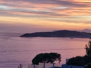 A coastal landscape with a view of the sea and a distant hill. - Costa Plana Collection (Cap d'Ail)