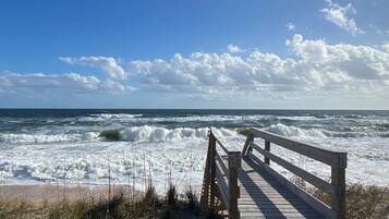 On the beach, sun loungers, beach towels