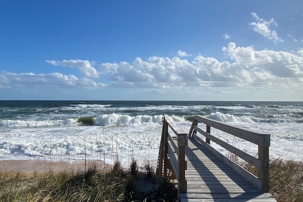 On the beach, sun loungers, beach towels