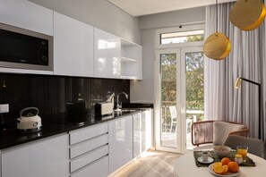 Fridge, microwave, stovetop, coffee/tea maker