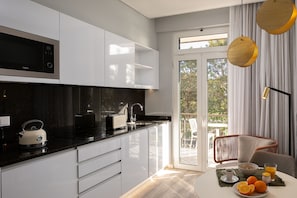 Fridge, microwave, stovetop, coffee/tea maker