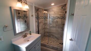 Shower, hair dryer, towels, soap