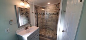 Shower, hair dryer, towels, soap