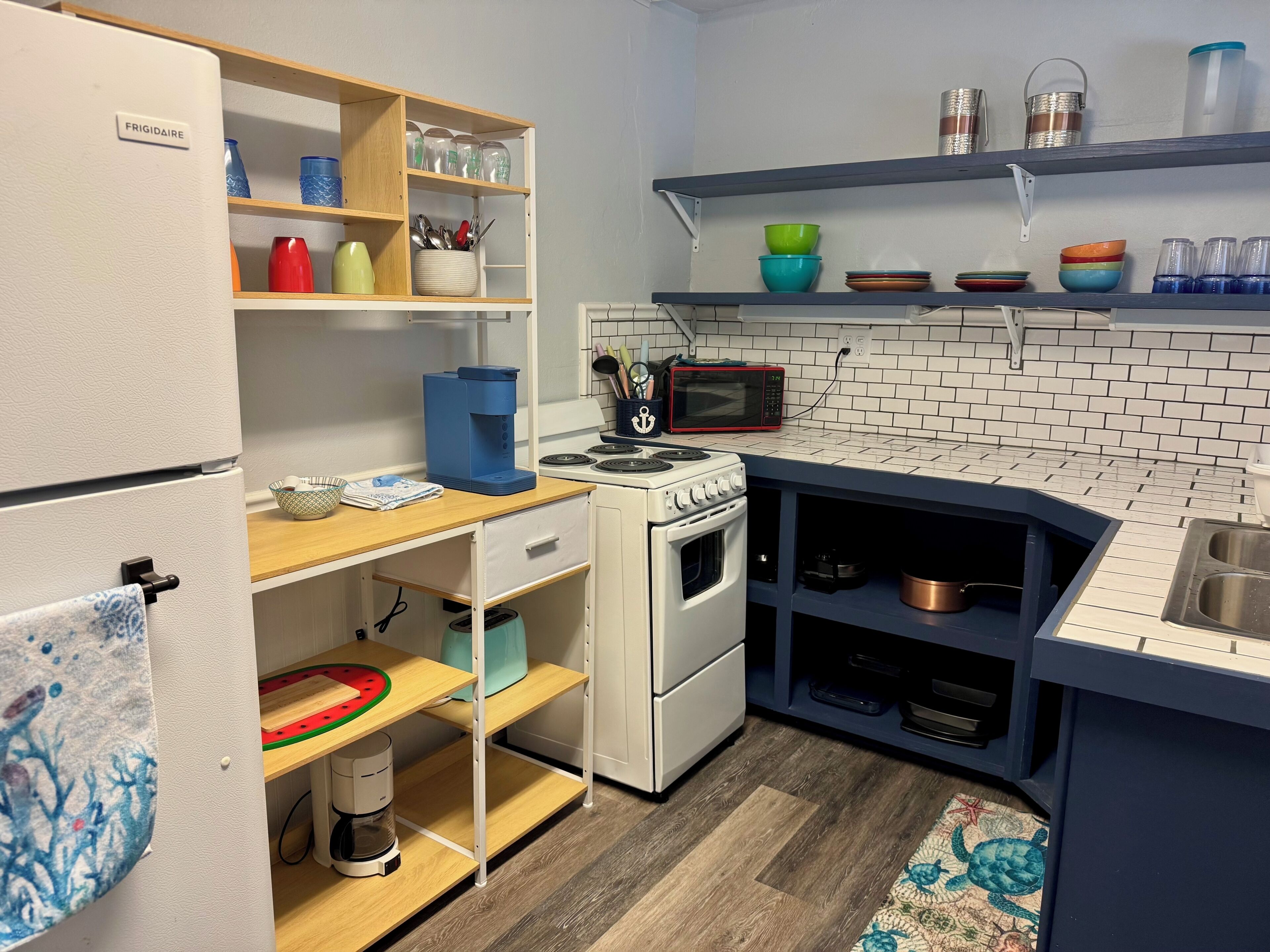 Fridge, microwave, coffee/tea maker, toaster