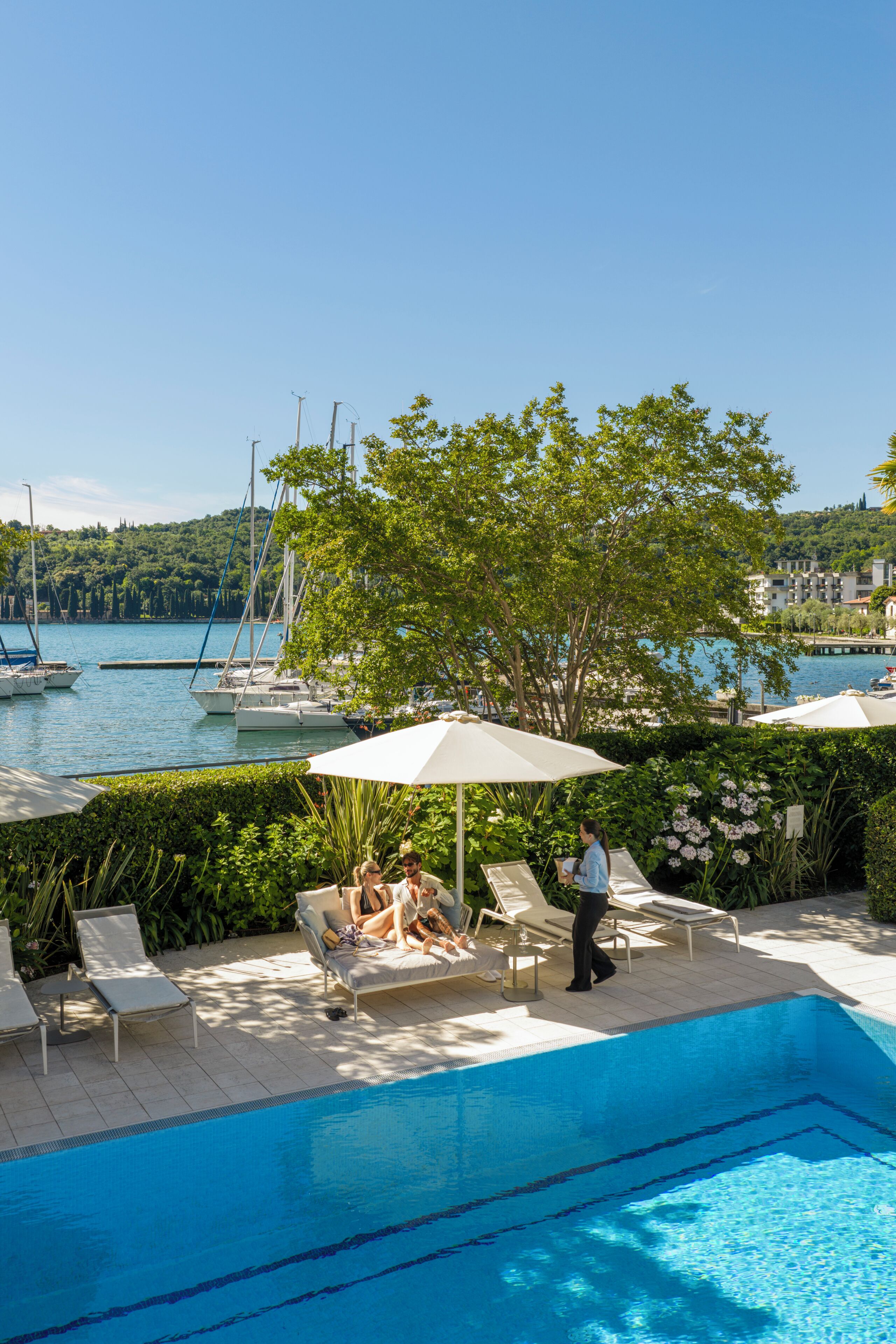 Seasonal outdoor pool, open 9:00 AM to 5:00 PM, pool umbrellas