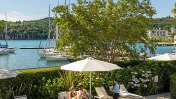 Seasonal outdoor pool, open 9:00 AM to 5:00 PM, pool umbrellas