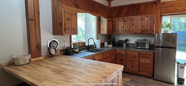 Fridge, microwave, stovetop, coffee/tea maker