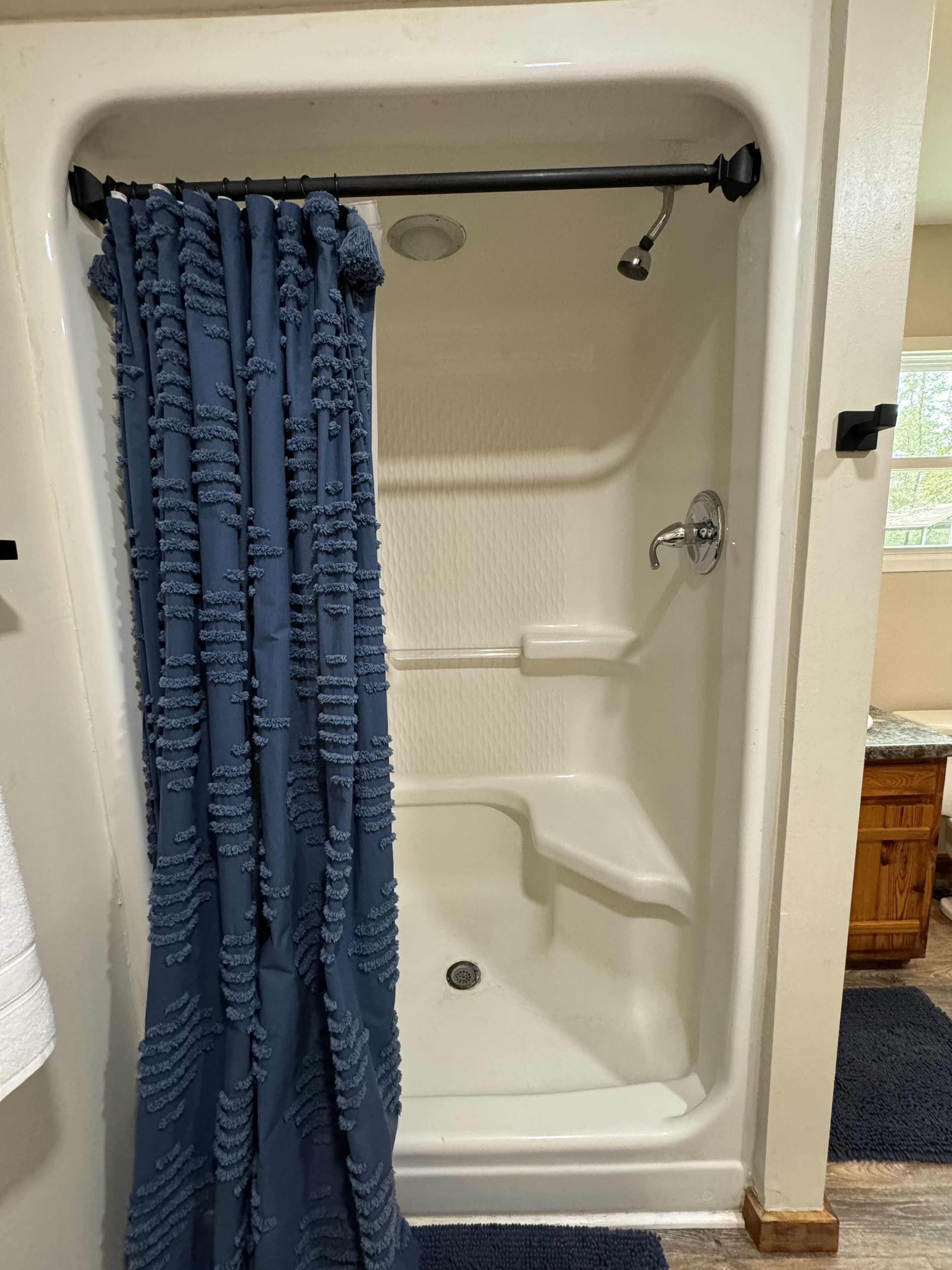 Shower, hair dryer, towels, toilet paper