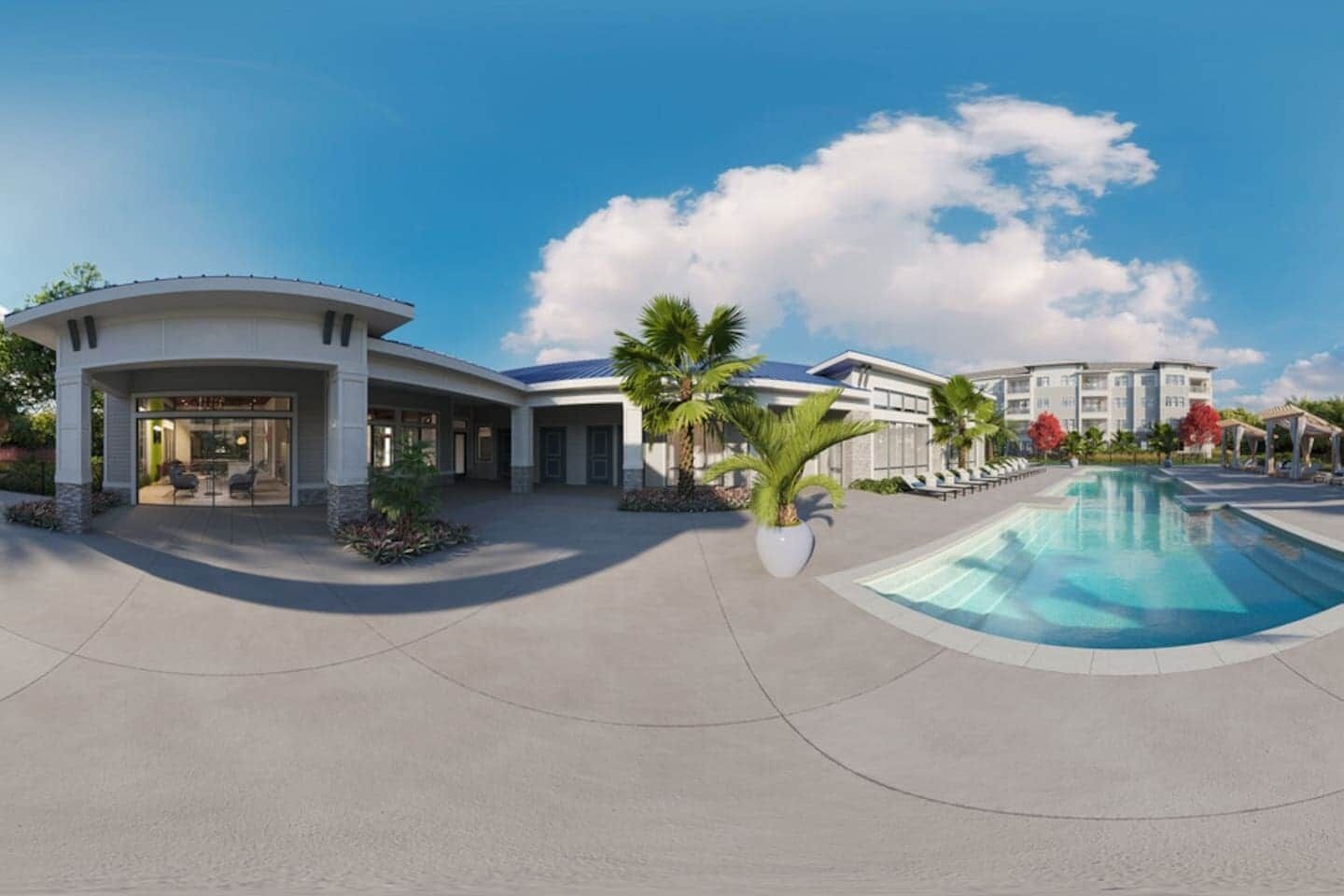 Ein modernes Hotel mit Pool, überdachter Terrasse und angelegten Grünflächen.