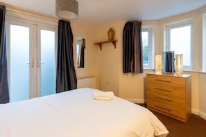 1 bedroom, desk, iron/ironing board, travel crib