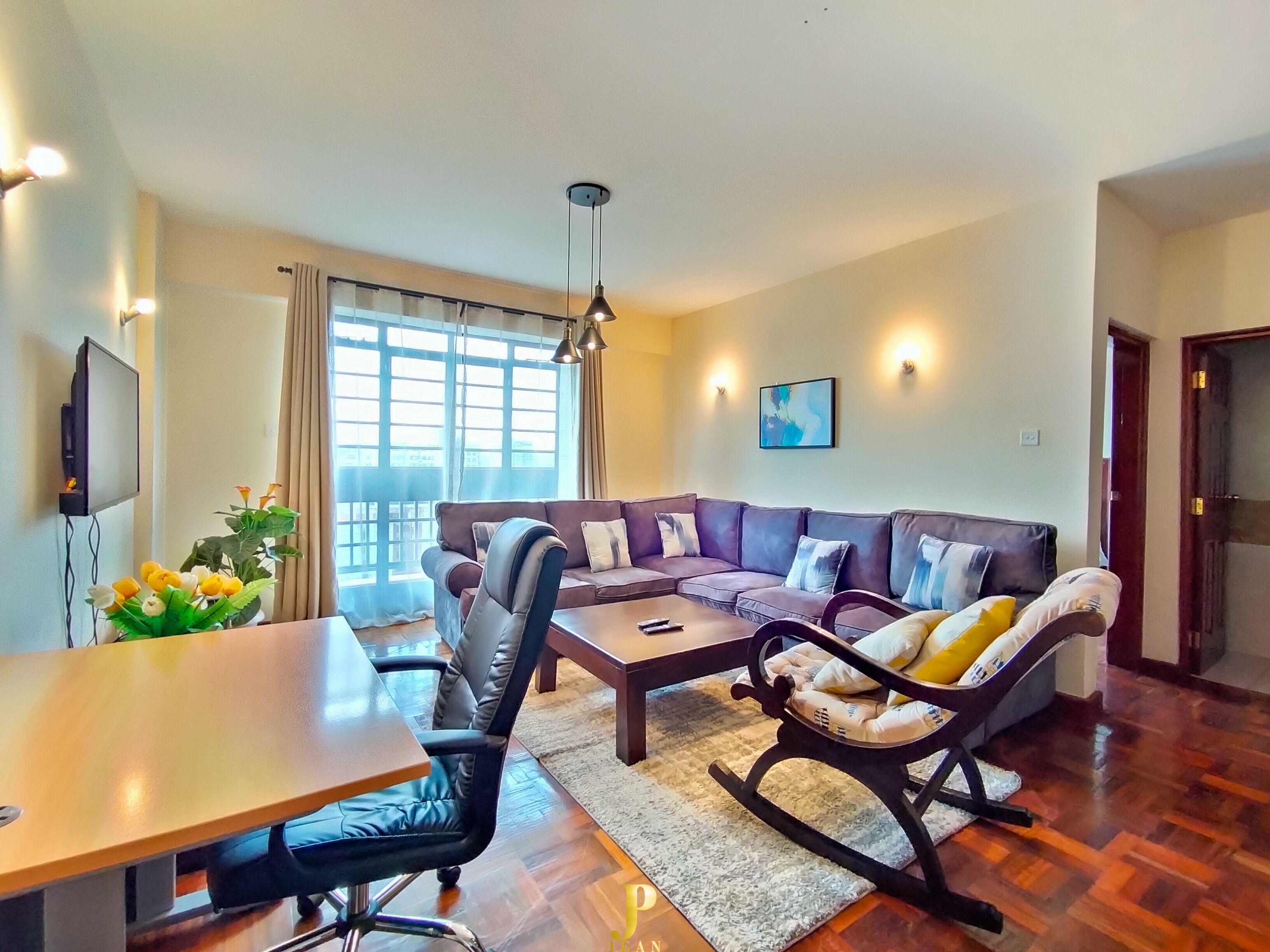 Elite Apartment | Living area | 24-inch Smart TV with satellite channels