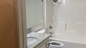 A bathroom with a double sink, a toilet, and a bathtub. - Modesto 2 Bdrm/2 Ba unit in gated area nr shopping, eateries, in unit wash/dryer (Modesto)