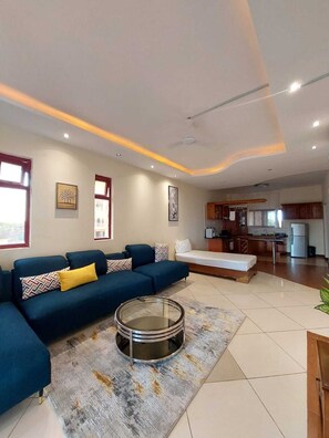 Deluxe Apartment | Living area | 24-inch Smart TV with digital channels - Lux Suites Shanzu Seabreeze Apartments (Mombasa)