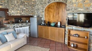 Panoramic Villa | Living area | 32-inch flat-screen TV with cable channels