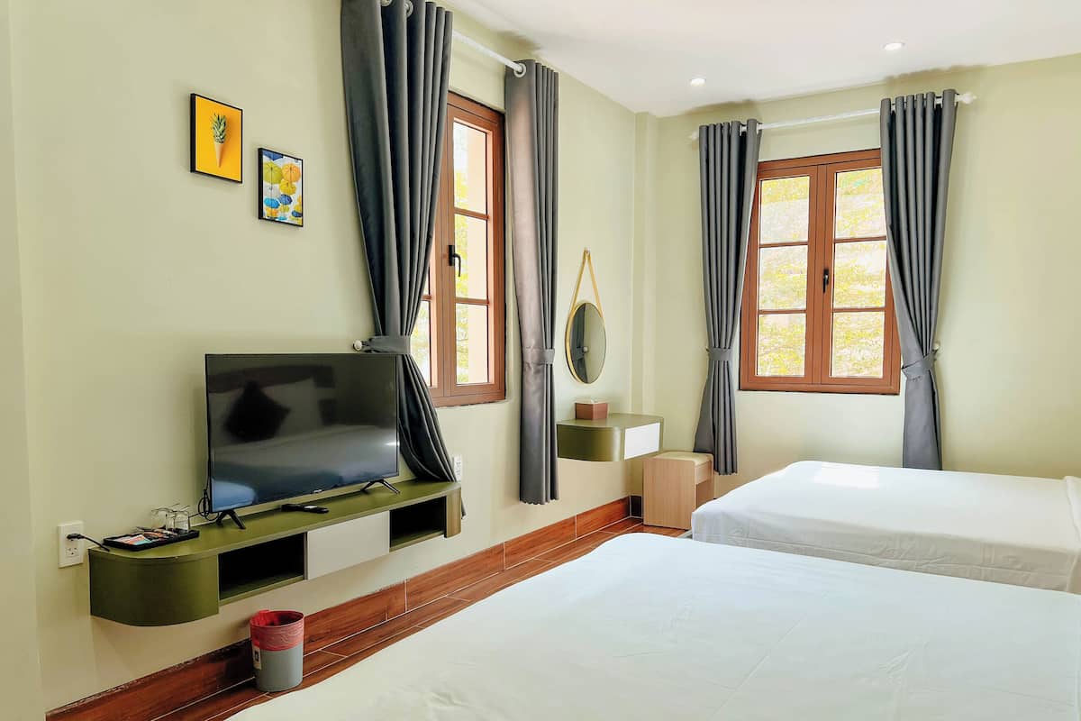 Family Quadruple Room | Pillow-top beds, minibar, desk, blackout curtains