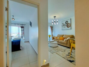 Comfort Apartment | Living area | 24-inch Smart TV with digital channels - Lux Suites Astoria Apartments Lavington (Nairobi)