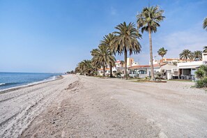 On the beach, sun-loungers