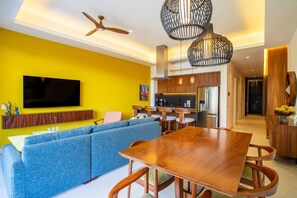 The smart TV can be watched from the dining table or the sofa - Modern Luxury 2BR in Romantic Zone (Puerto Vallarta)