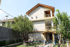 Enjoy a home away from home with a balcony overlooking the garden and patio area.