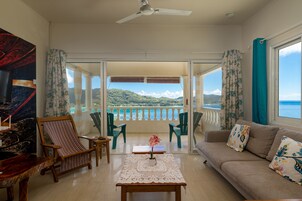 Standard Apartment, Sea View | Living area | Flat-screen TV