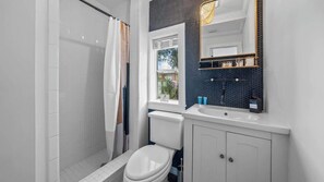 Shower, hair dryer, towels, soap - Cottage w/Fully Fence Backyard, Patio + Laundry (Tampa)