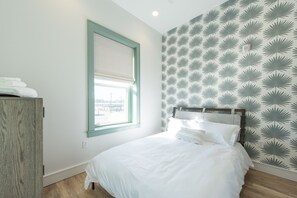 1 bedroom, desk, iron/ironing board, travel crib