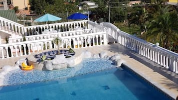 Outdoor pool, pool umbrellas, sun loungers