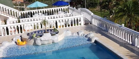 Outdoor pool, pool umbrellas, sun loungers