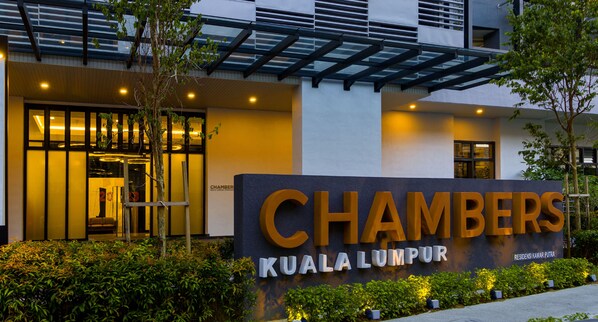 A hotel entrance with a large sign reading "CHAMBERS KUALA LUMPUR" and a modern building facade. - Chambers Residence Kuala Lumpur by Roam (Kuala Lumpur)