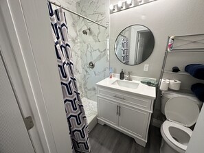 Shower, hair dryer, towels, soap