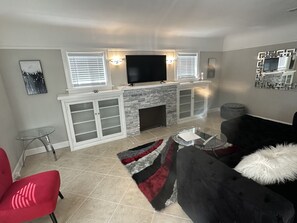 Smart TV, fireplace, books