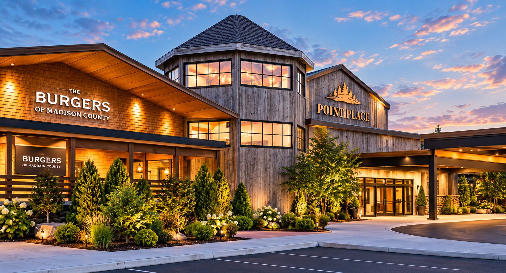 A hotel with a prominent sign for 'The Burgers of Madison County' and a separate sign for 'Point Place.'