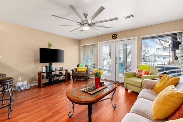 Relax in style in this inviting living room featuring a plush couch and two chic accent chairs.