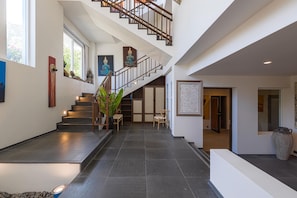 Exclusive Villa | Living area | 65-inch TV with cable channels