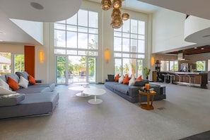Exclusive Villa | Living area | 65-inch TV with cable channels