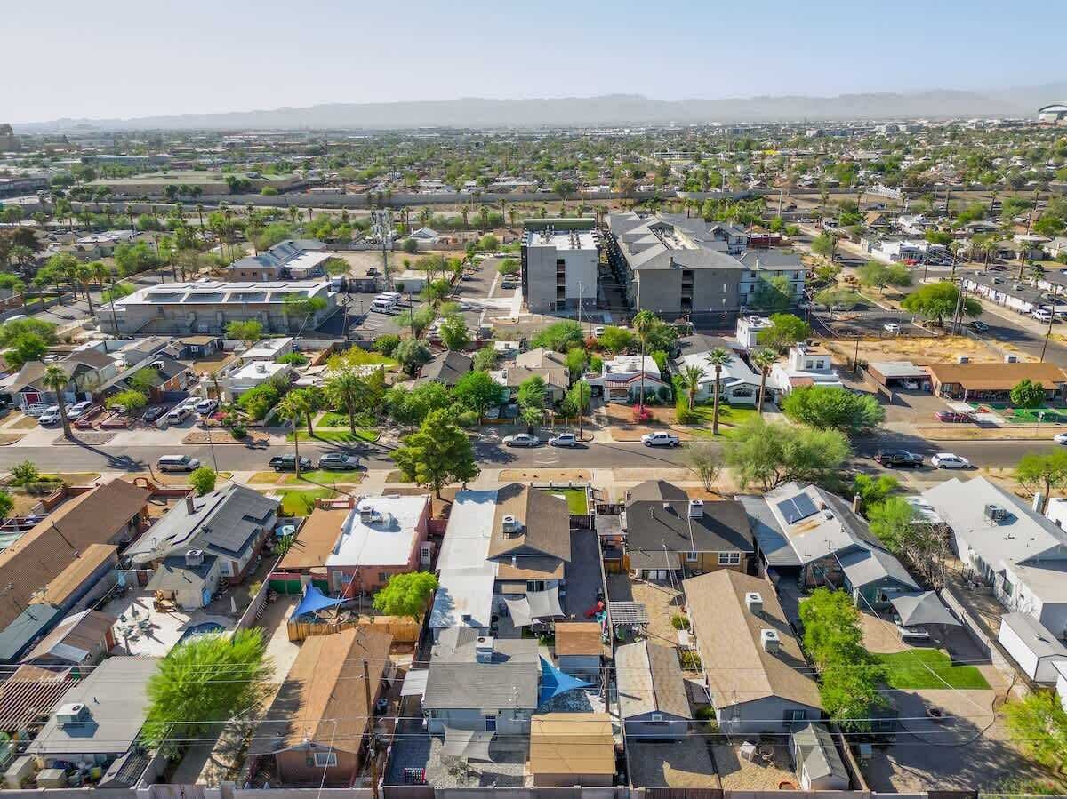 An aerial view of a residential neighborhood with houses, streets, and greenery.