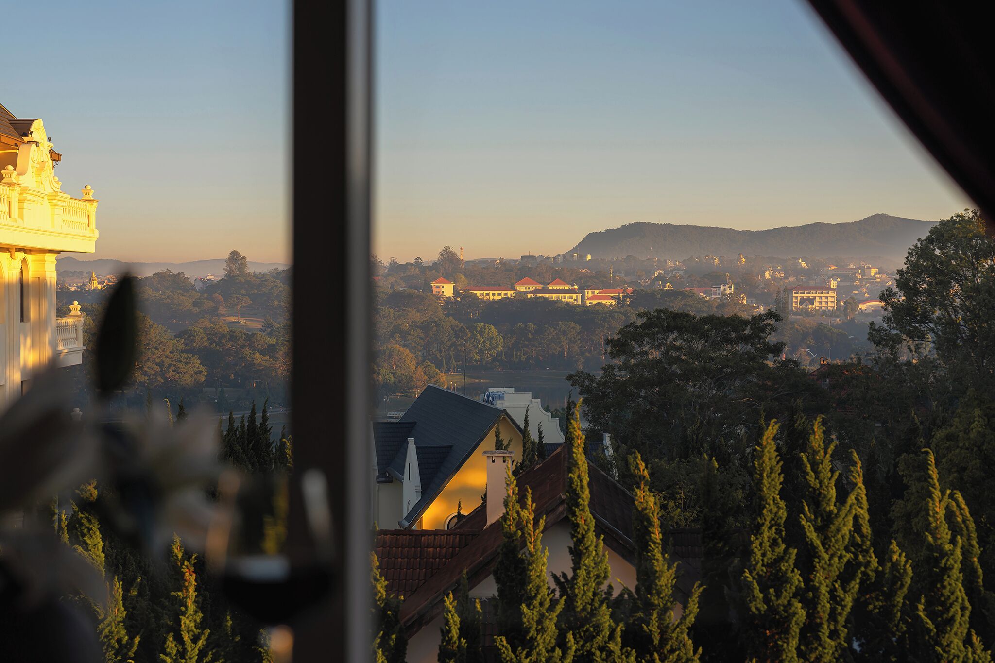 A view of a cityscape with buildings and trees.