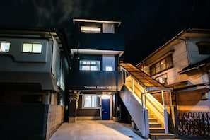 A building with a sign reading 'Vacation Rental NISHIDA' at the entrance. - Vacation Rental NISHIDA (Kagoshima)