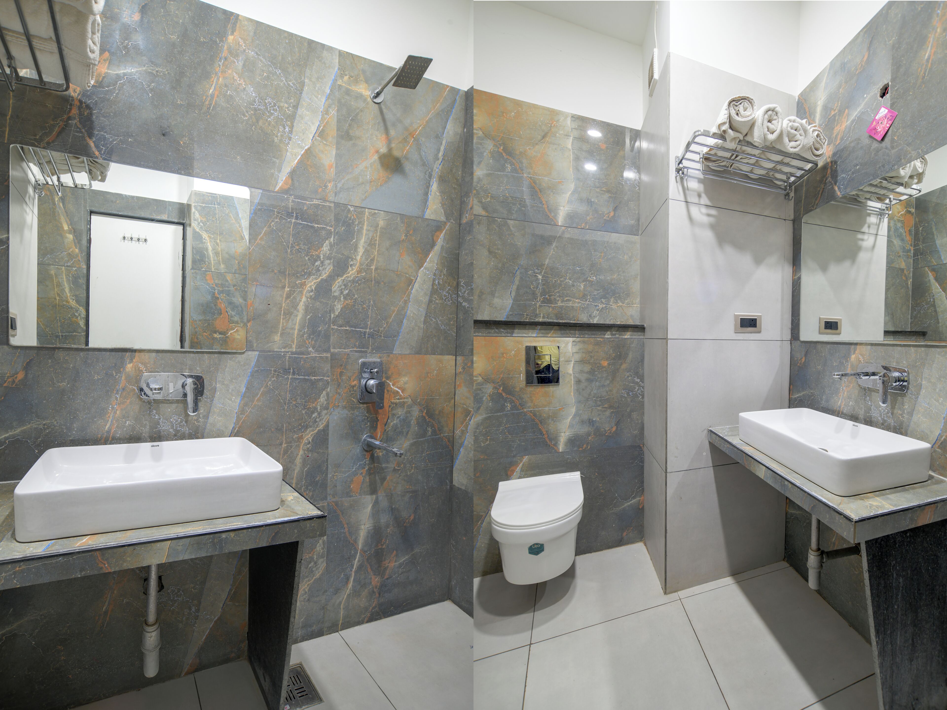 A modern bathroom with two sinks, a toilet, and a shower.