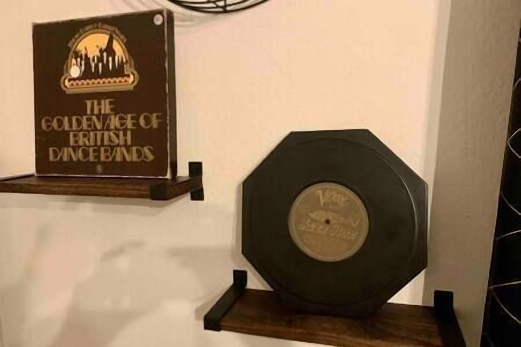 A plaque and a vinyl record on display.